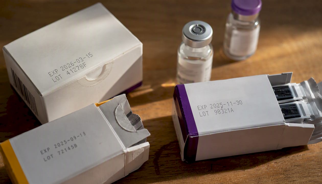 Close-up of diabetic supplies expiration dates