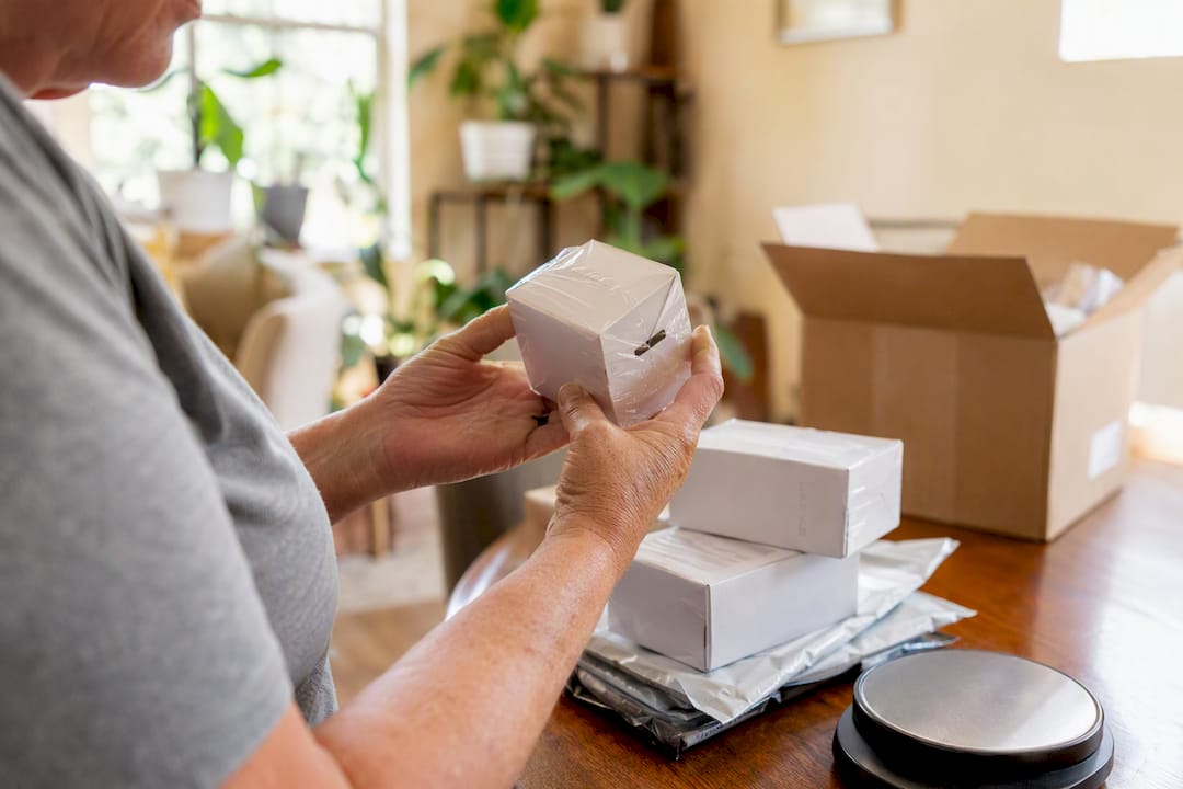 Hands inspecting sealed diabetic supplies